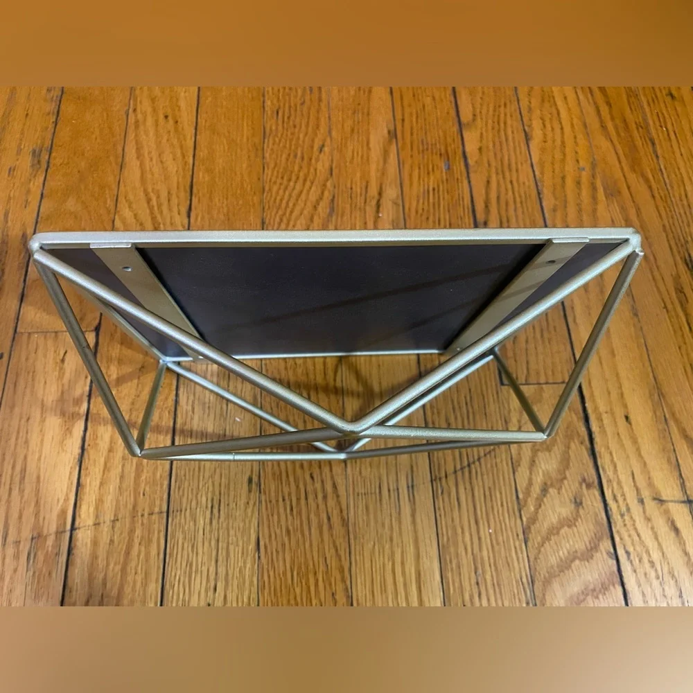 Mirror with geometric metalwork